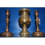 A pair of brass candlesticks, 20cm high, and brass vase raised on circular footed base.21cm high.