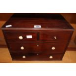 A miniature mahogany chest of two short and two long drawers, with bone handles, 36cm wide