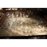 A quantity of assorted glassware to include decanters, etched champagne glasses, liqueur glasses,