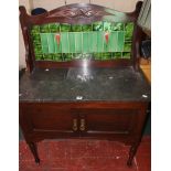 A late Victorian mahogany, marble topped and tile back washstand