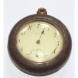 An unusual brass cased L'Ingenieuse pocket watch with anti clockwise second hand, in a protective