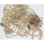 A quantity of simulated pearl necklaces to include on graduated necklace with a 9ct gold clasp