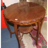 An Edwardian mahogany two tier occasional table 74cm diameter