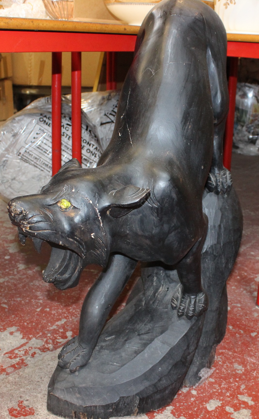 A carved wooden panther, 80cm high approx.