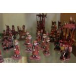 Two Indian wooden and painted chess sets (32 pieces) (af)