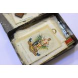 A collection of silk cigarette cards and a small 'Relic of the H.M.S. Victory in a tin