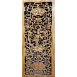 A Chinese elm cabinet with pierced carved decoration of figures in a landscape, with pine sides