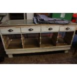 A painted and glazed shop display cabinet 182cm length
