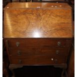 A walnut bureau, 20th century with three drawers on cabriole legs 76cm wide