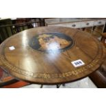 A walnut circular occasional table with Tunbridgeware style inlaid top on brass splayed legs