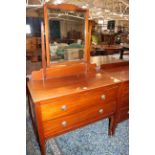 An Edwardian mahogany dressing table and chest with two short and two long drawers