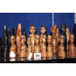 A 20th Century African wooden chess set (32 pieces) and another smaller chess set