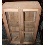 A pine cupboard 61cm high, 92cm wide