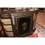 A Victorian ebonised and gilt metal mounted credenza with glazed shaped cupboards flanking central