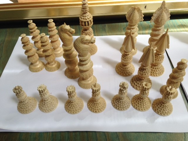 A quantity of 19th Century Anglo - Indian stained ivory chess pieces, heavily ornate, a mix of two - Image 8 of 9