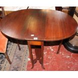 A sutherland mahogany table with a shaped undertier and a pair of 19th Century mahogany dining