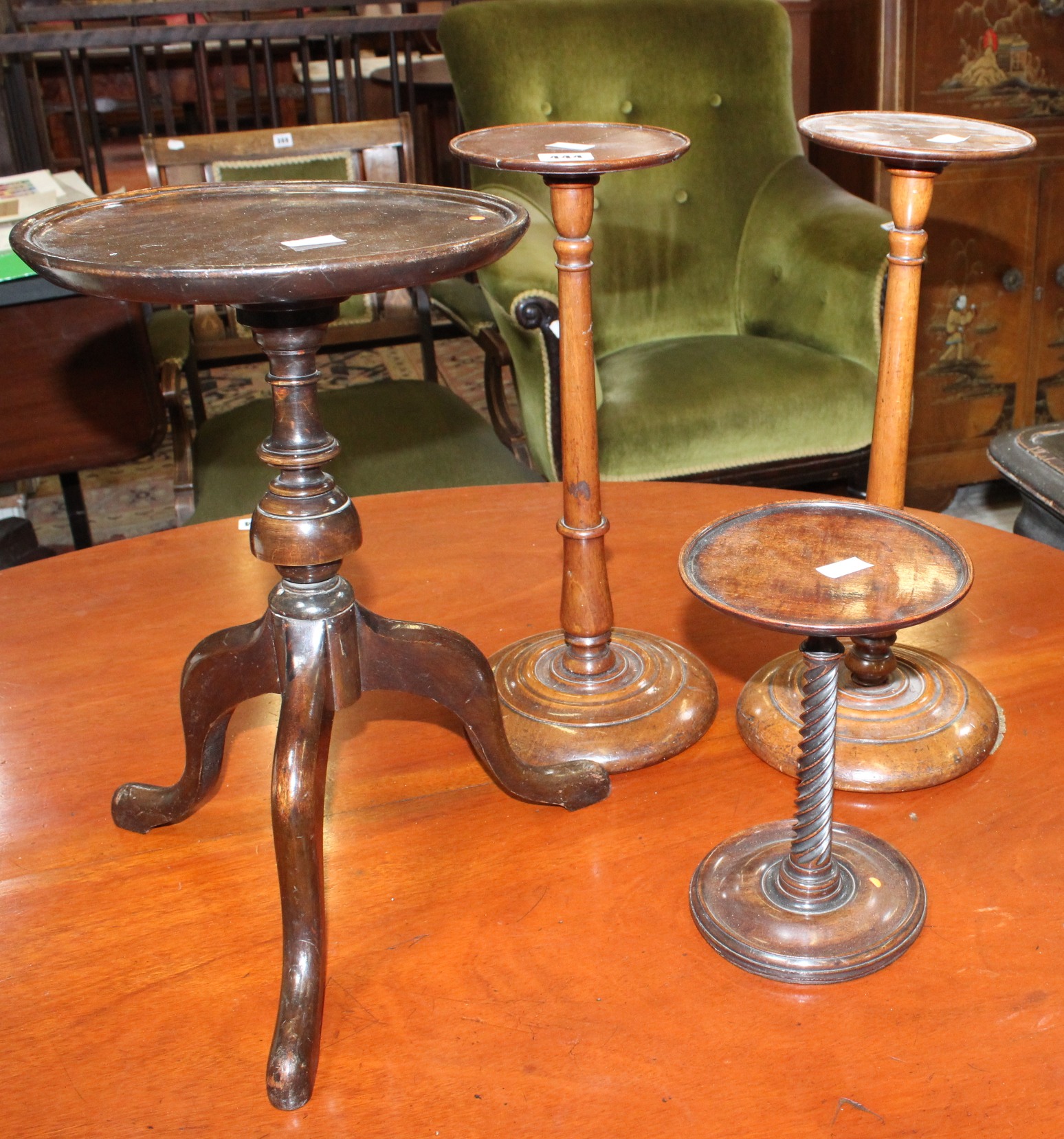 A pair of mahogany candlesticks another with spiral column and kettle stand