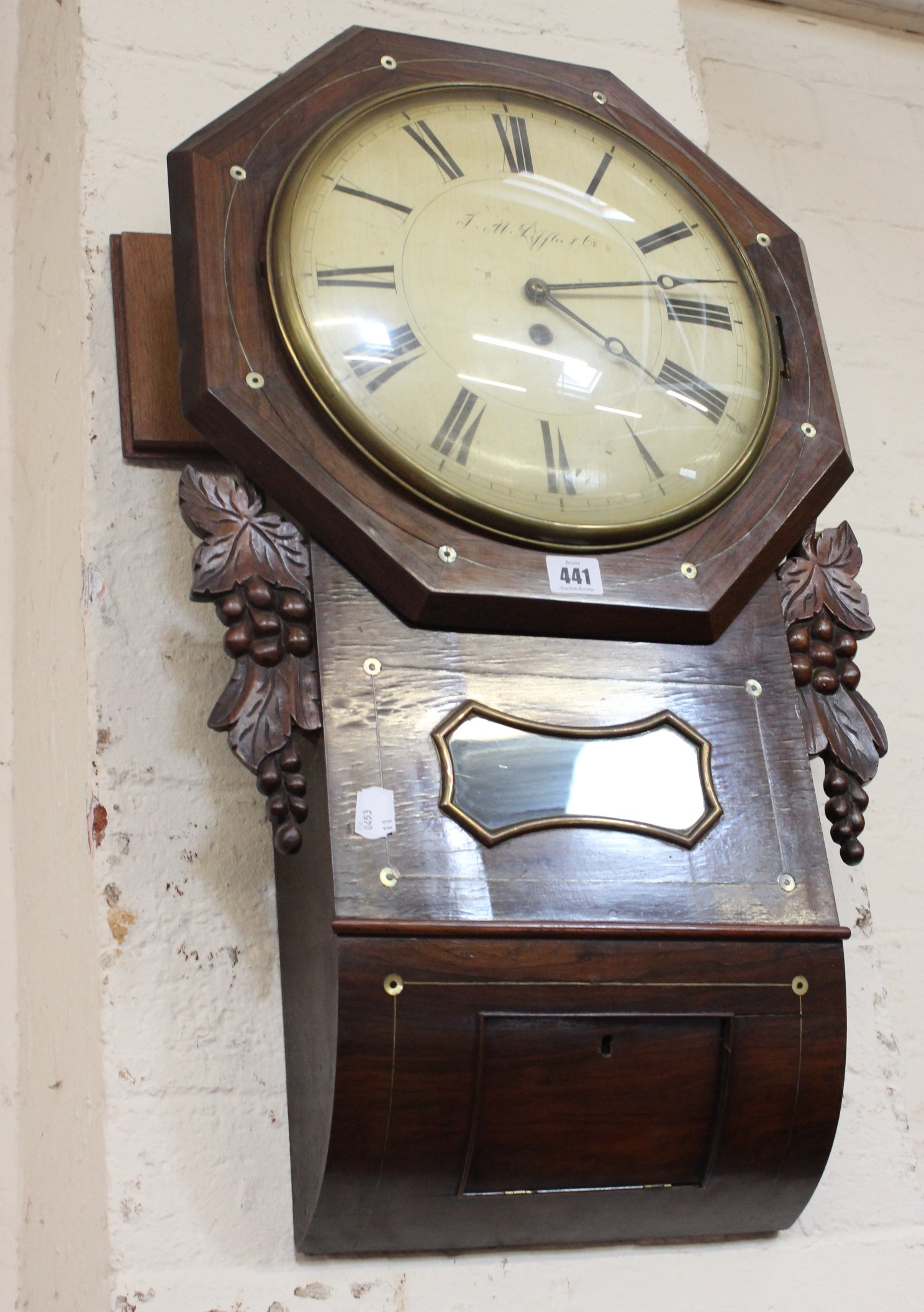 A 19th Century rosewood wall clock with painted dial J.F Liffer & Co