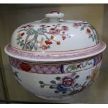 A Chinese Famille Rose circular tureen and cover, 20th century, painted with flowers in Chinese