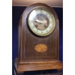 An Edwardian mahogany inlaid mantel clock