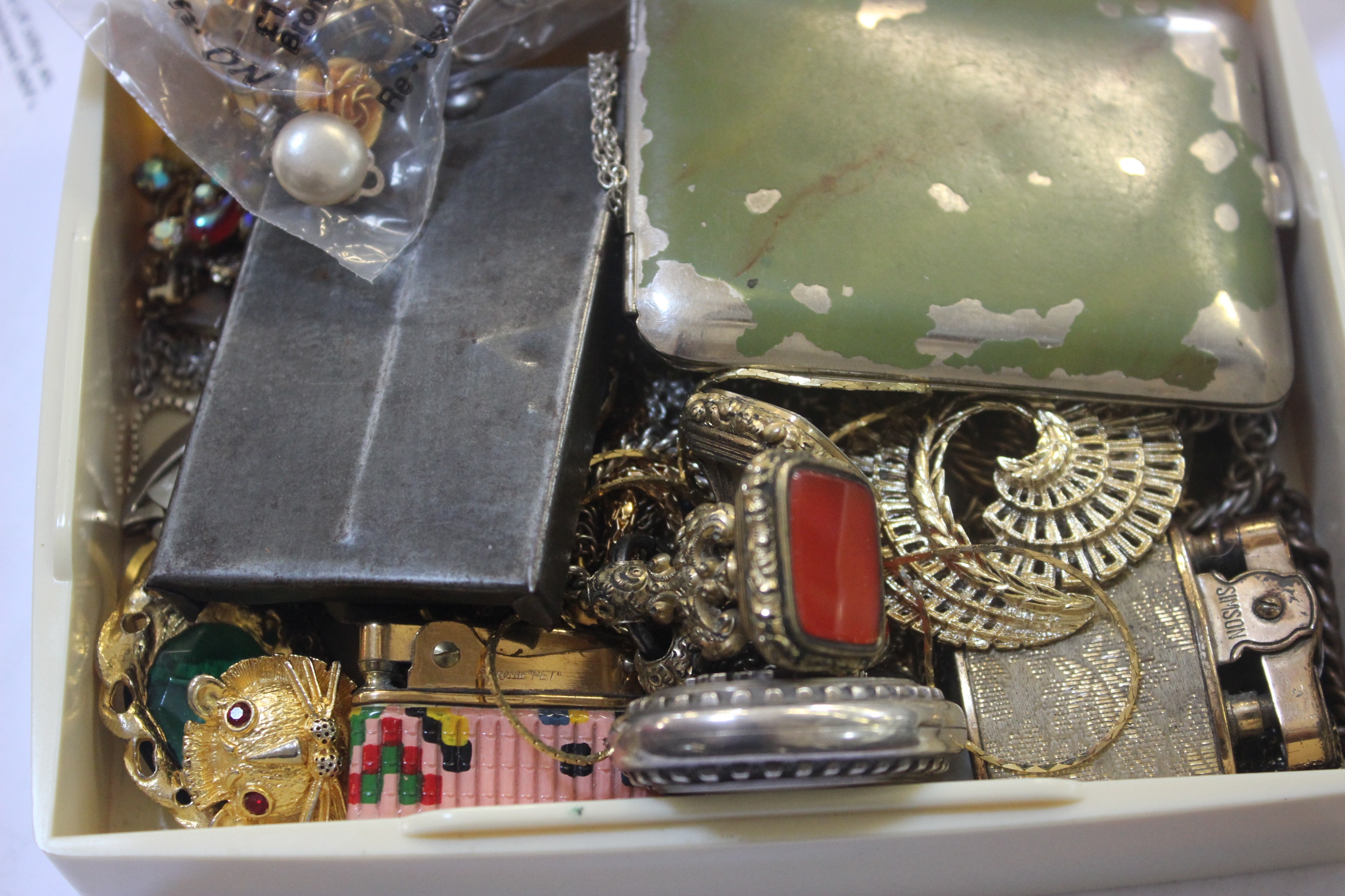 A mixed lot to include fobs, lighters and costume jewellery