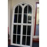 A large arched stain glass window 236 x 114cm and another half window 114 x 114cm