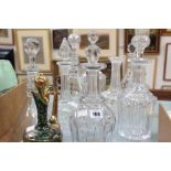 Assorted decanters and a green glass decanter with matching glasses
