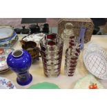 A mixed lot of ceramics, glassware and a tin