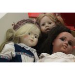 Three various girl dolls