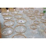 Venetian Glass a part suite of nine champagne, twenty two various size wine, two gilded decanters,