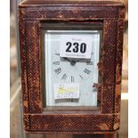 A carriage clock in travelling case, 14.5cm high including handle