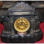 A large black slate mantel clock, 38cm high