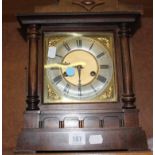 A Oak cased mantel clock with German eight-day gong striking movement, 34cm high (af)