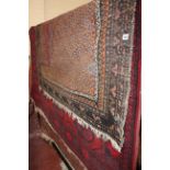 An Afghan rug, 202 x 171cm together with two further Persian rugs