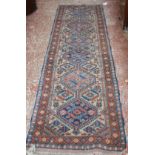 A Persian runner of Kazak design 272 x 72cm