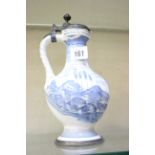 A reproduction German faience blue and white jug, 22cm high (af)