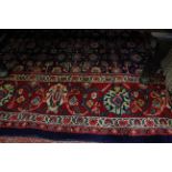 A large Middle Eastern rug with floral ground 290 x 390cm