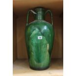 A green two handled pitcher, 53cm high