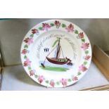 A 19th Century creamware plate enamelled with a boat and an inscription in German “Das Schiff…”,