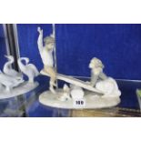 A Lladro group of two children on a seesaw, Lladro geese, a Nao figure, a Royal Copenhagen figure of