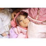 Large lifelike collectors baby dolls by ADG, Gotz and similar within two straw cribs (a lot)