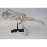 [Collectors] A Composite Model of a Dinosaur Skeleton mounted on a steel stand for display, 60cm