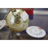 A glass table clock, globe shaped, 6cm high (af)