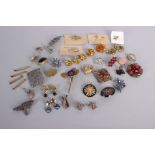 A collection of costume jewellery, including: silver clip-on earrings, silver filigree earrings, a