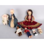 A 1920s cloth and felt nightdress case doll, a large pin cushion doll with composition head, an