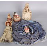 A 19th century silk pin cushion with ceramic doll body, a bisque pin cushion doll, a 1920s boudoir