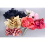 A collection of silk and paper millinery and corsage flowers and petals, dating from the 1930s to