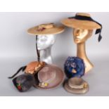 Three early 20th century children's straw hats and four small dolls hats of a similar date, (7).