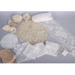 A collection of 19th and early 20th century lace, comprising: small panels, motifs and filet lace of