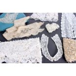 A collection of 19th and early 20th century lace and broderie anglais, including: collars, mats,